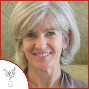 A photo of a woman looking at the camera and smiling, she has short white hair. The podcast logo is in the lower left corner.