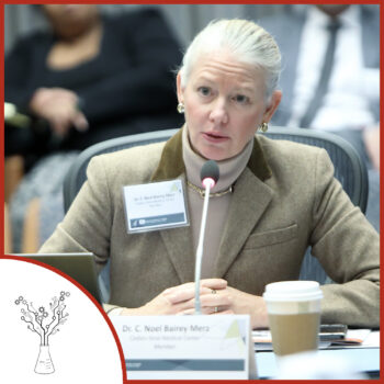 A photo of Dr. Merz speaking into a microphone at an event. The podcast logo is on the lower left.